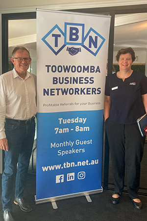 Toowoomba Business Networkers member Robin Grundon & Bronwyn Evans with TBN banner
